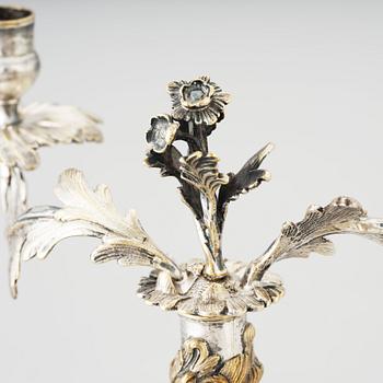 A pair of Swedish Rococo argent haché candelabra.