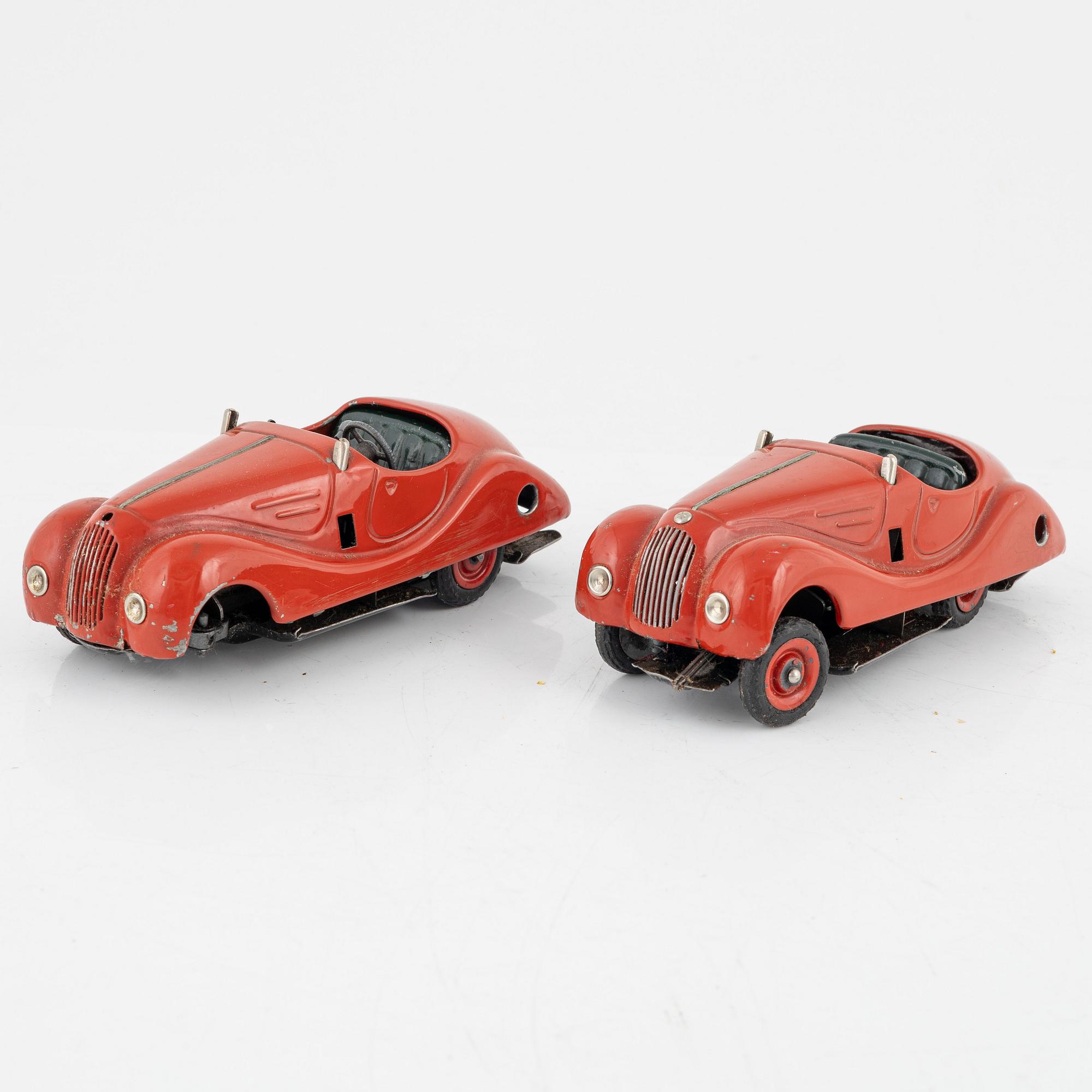 A set of five toy cars, mostly Schuco, Germany.