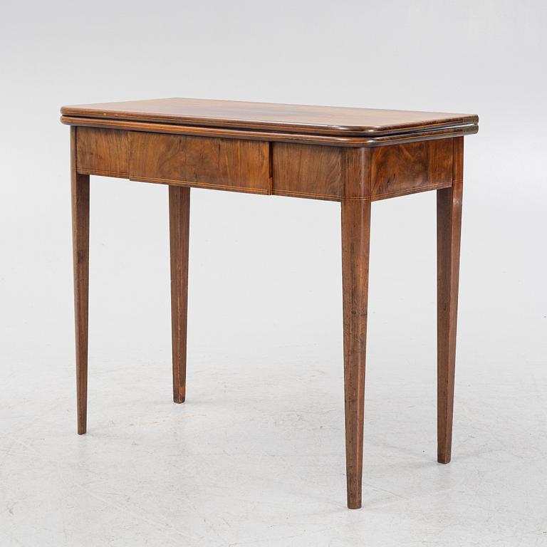 A mahogany games table, early 19th Century.