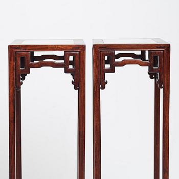 A pair of Chinese pidestals, 20th Century.