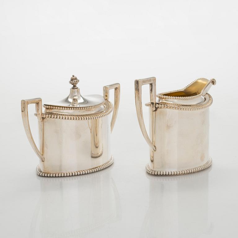 An early 20th century 4- piece sterling silver empire coffee set, C.G. Hallbergs Guldsmeds AB, Stockholm.