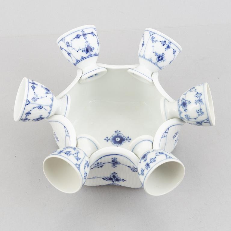 A set with six egg servers, a stand and a salt shaker, "Blue fluted"/"Musselmalet", Royal Copenhagen, part 19th century.