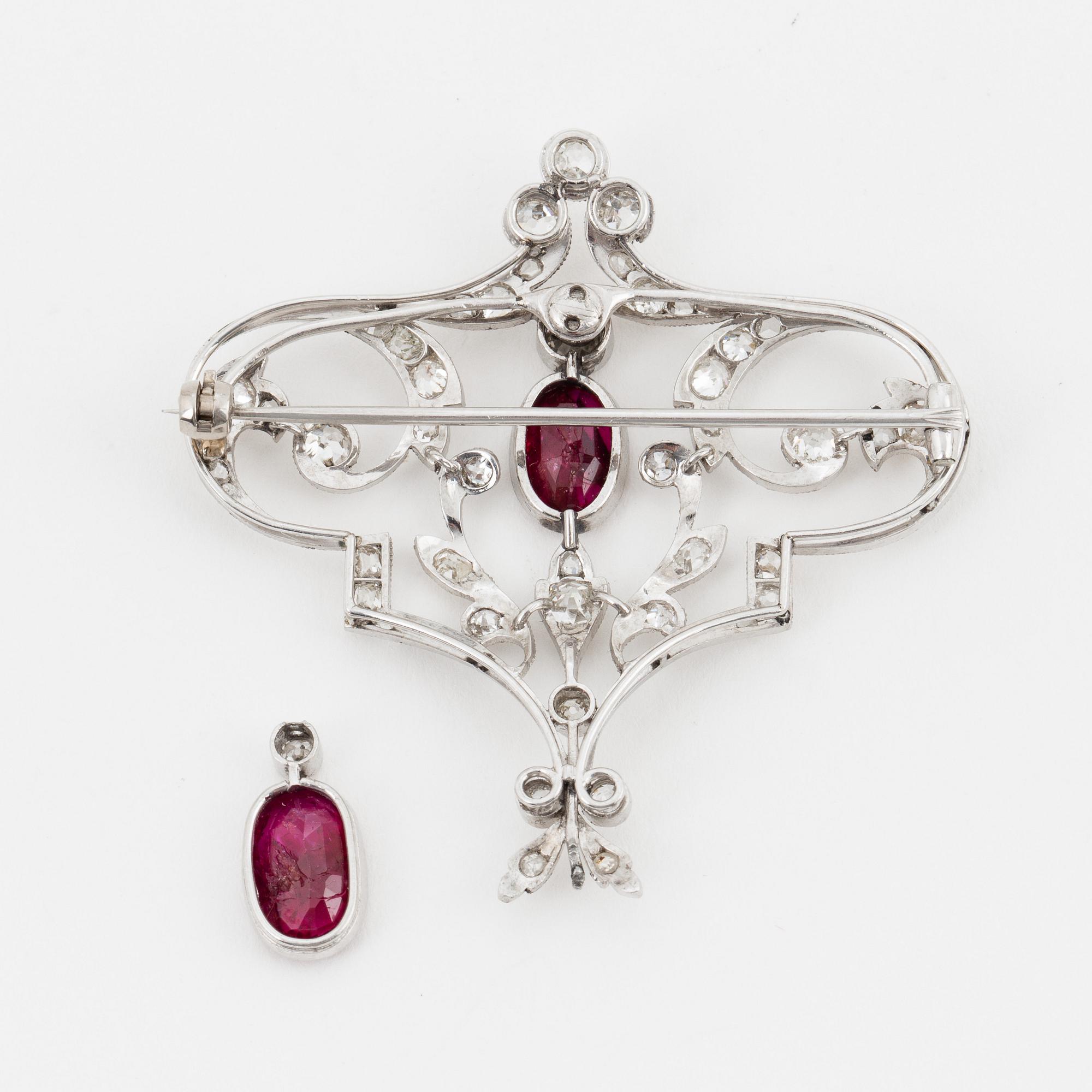 An old-cut diamond and ruby brooch.