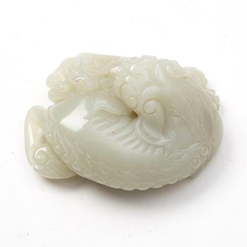 A nephrite sculpture of a reclining buddhist lion with its cub, presumably late Qing dynasty.