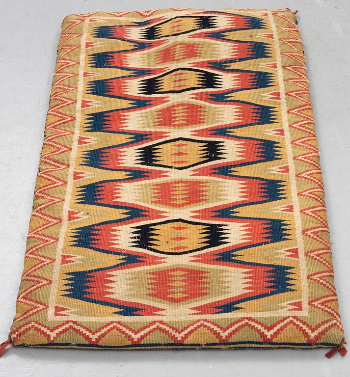 A carriage cushion, double-interlocked tapestry, ca 81 x 50 cm, Scania, mid 19th century.