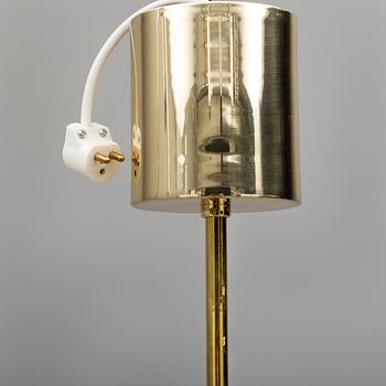 A 1970s brass ceiling light with glass shade. Height ca 144.