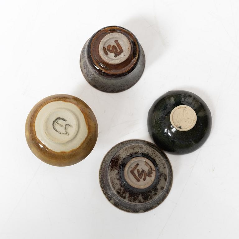 A set of fourteen stoneware vases and ten bowls, predominantly John Andersson, Höganäs.