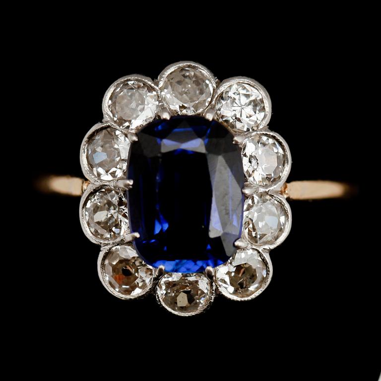 RING, 18 k guld, 10 briljanter totalt 0.90 ct samt syntetisk safir.