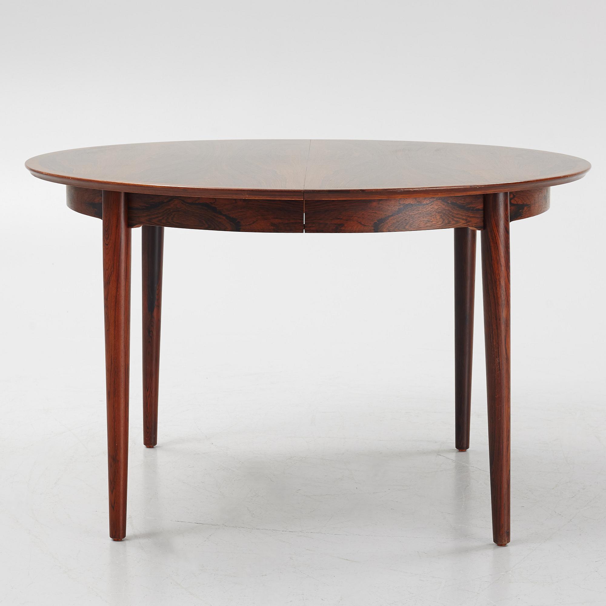 Niles Otto Møller, a rosewood veneered table with four chairs, JL Møller, Denmark, 1950's/60's.