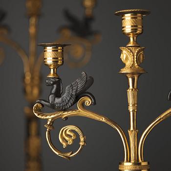 A pair of three-light Empire candelabra, early 19th century .