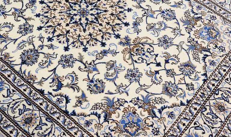 A rug, Nain part silk, ca 235 x 160 cm.