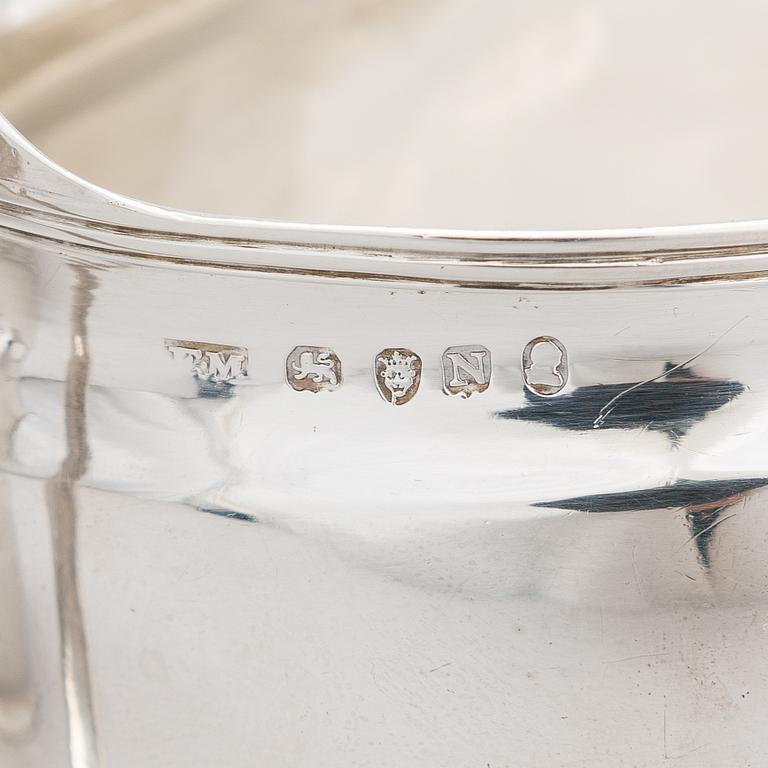 An early 19th-century, sterling silver sugar bowl, mark of Elizabeth Morley, and a cream jug, marked A.B, London 1808.