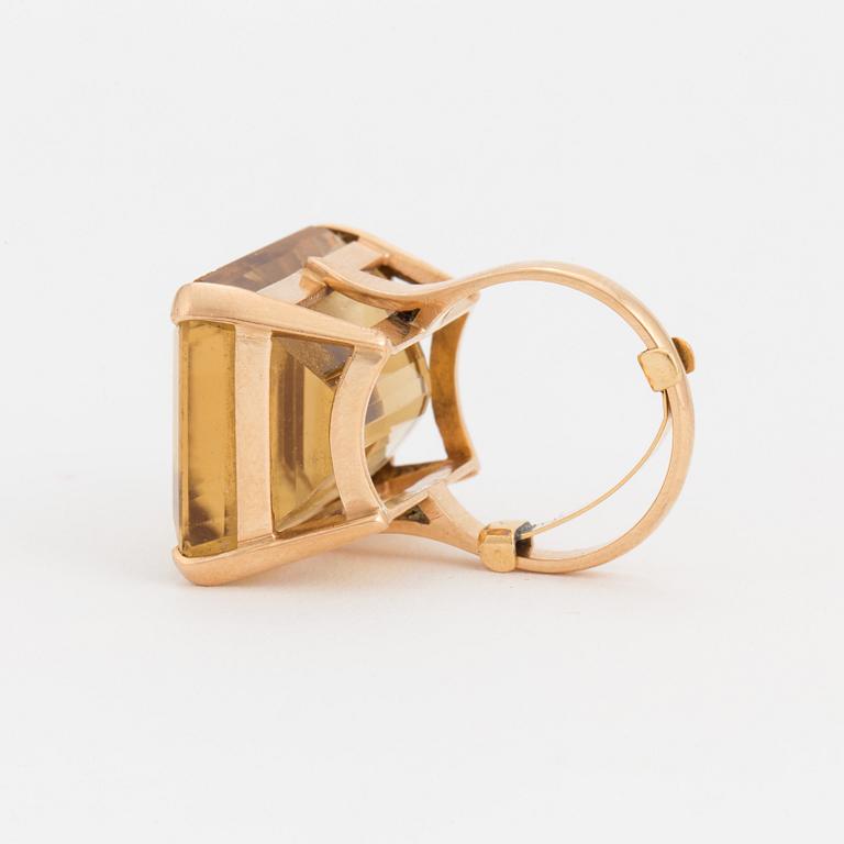 A ring set with a step-cut citrine.