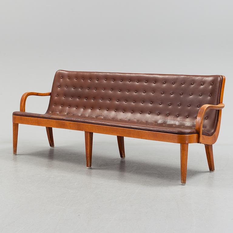 An Axel Larsson stained beech leather upholstered sofa, Svenska Möbelfabrikerna Bodafors, 1930's.