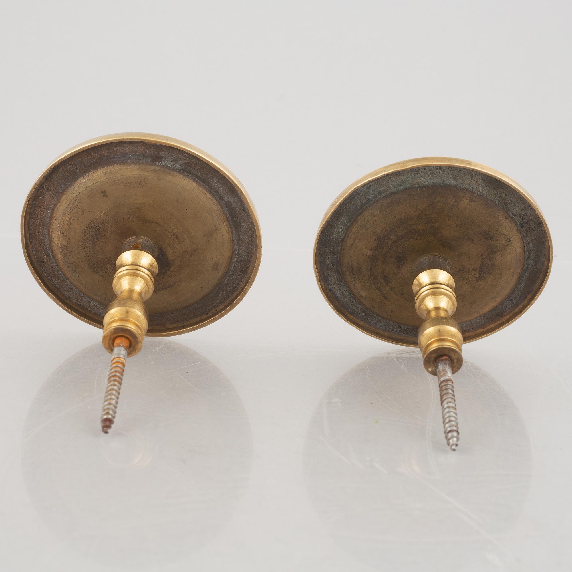 A pair of gilt-bronze Empire-style curtain holders, 19th century.