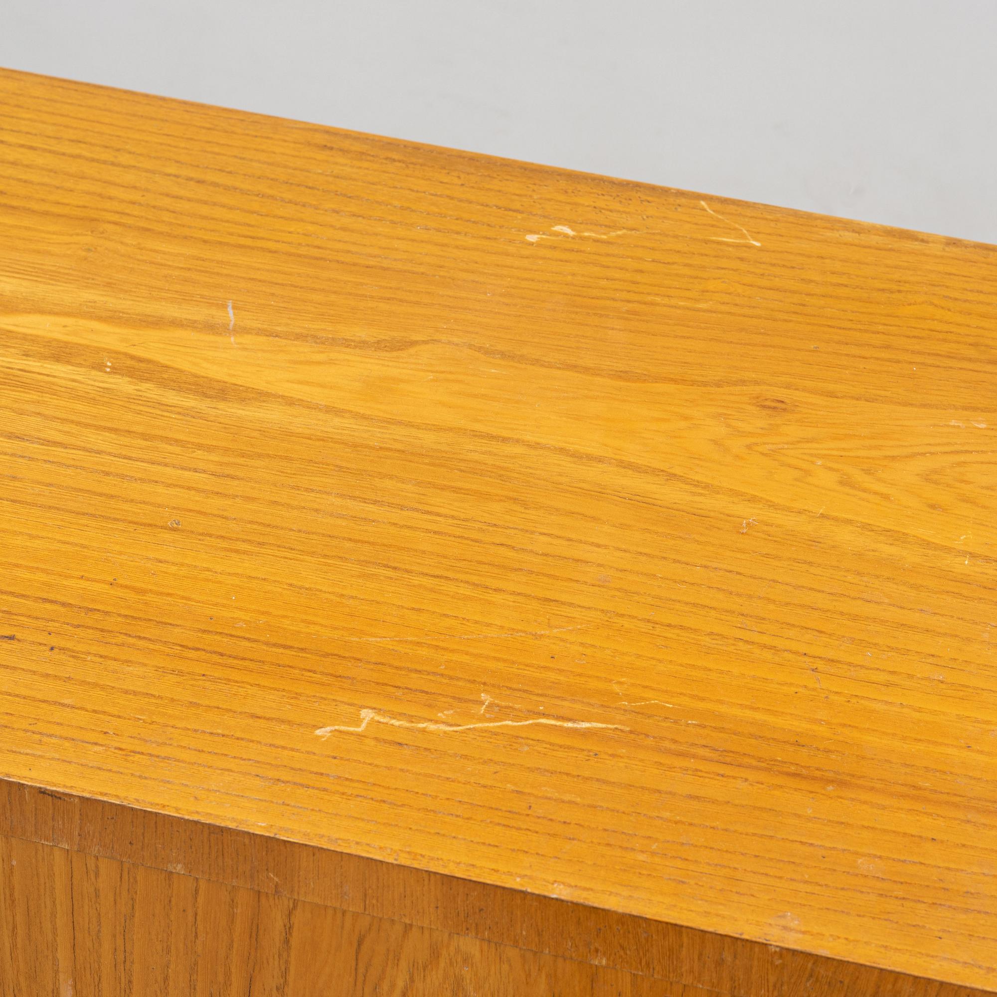 An elm wood veneered dresser, mid 20th Century.