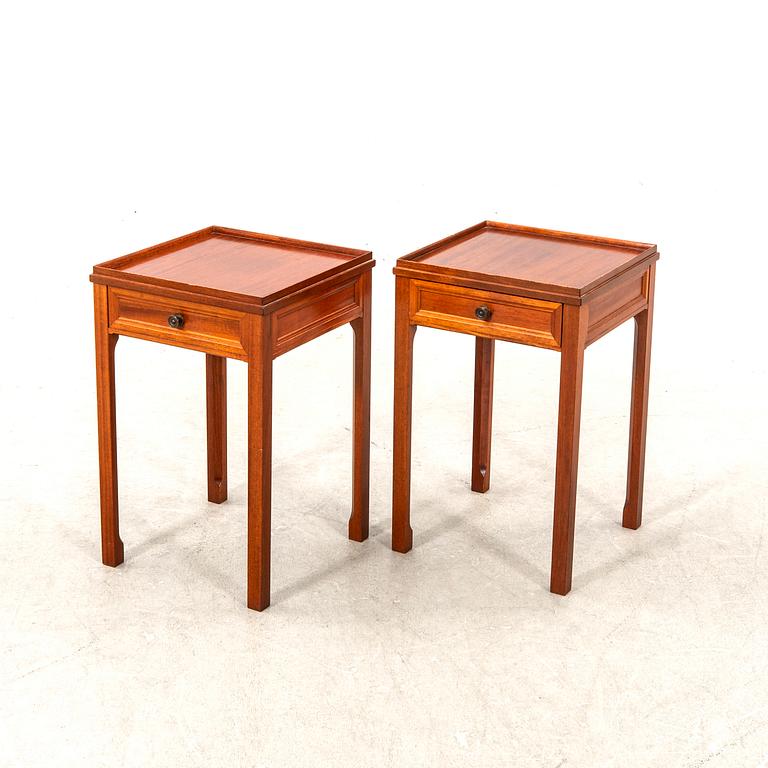 A pair of mahogany bedside tables by svensk möbelindustri second half of the 2+th century.