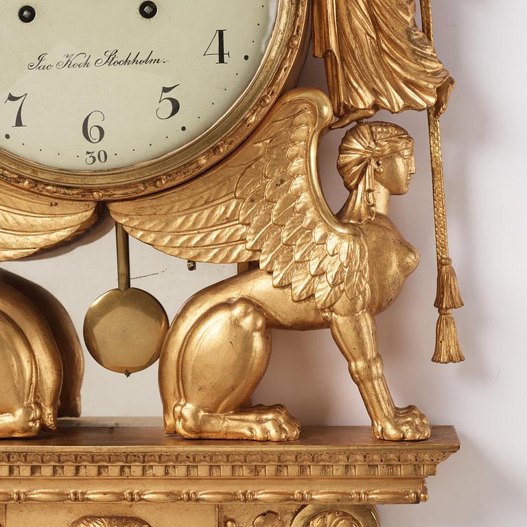 A late Gustavian giltwood cartel clock by J. Kock (royal watchmaker, active 1762-1803).