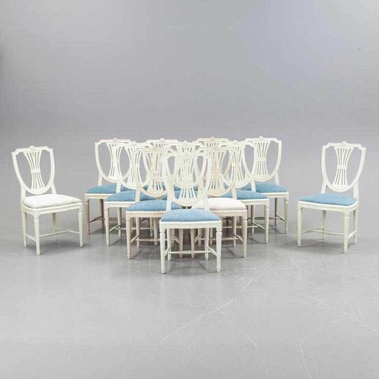 A set of a dozen white gustavian style chairs, second half of 20th century.