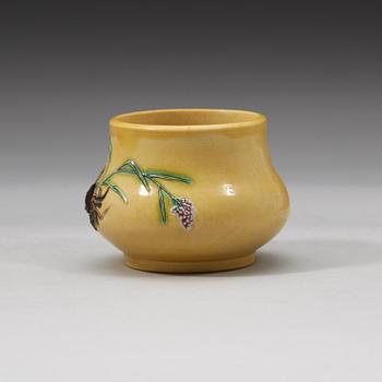 A yellow brush pot, Qing dynasty with Daoguang mark and period (1821-1850).