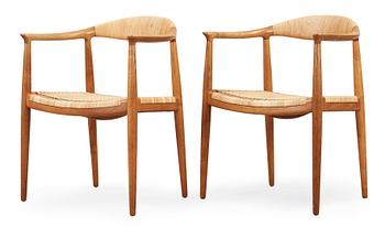 62. A pair of Hans J Wegner oak and rattan 'The Chair' armchairs by Johannes Hansen, Denmark.