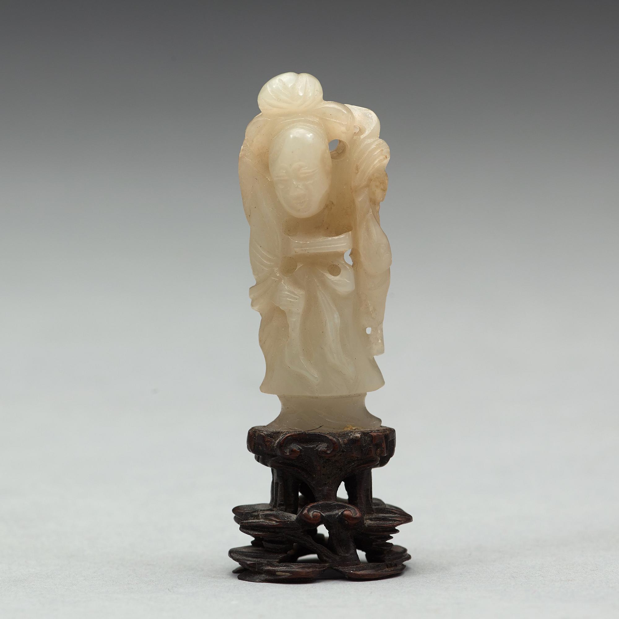 A nephrite cup and figurine, China, early 20th Century.