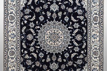 A carpet, Nain, part silk, ca 310 x 205 cm.