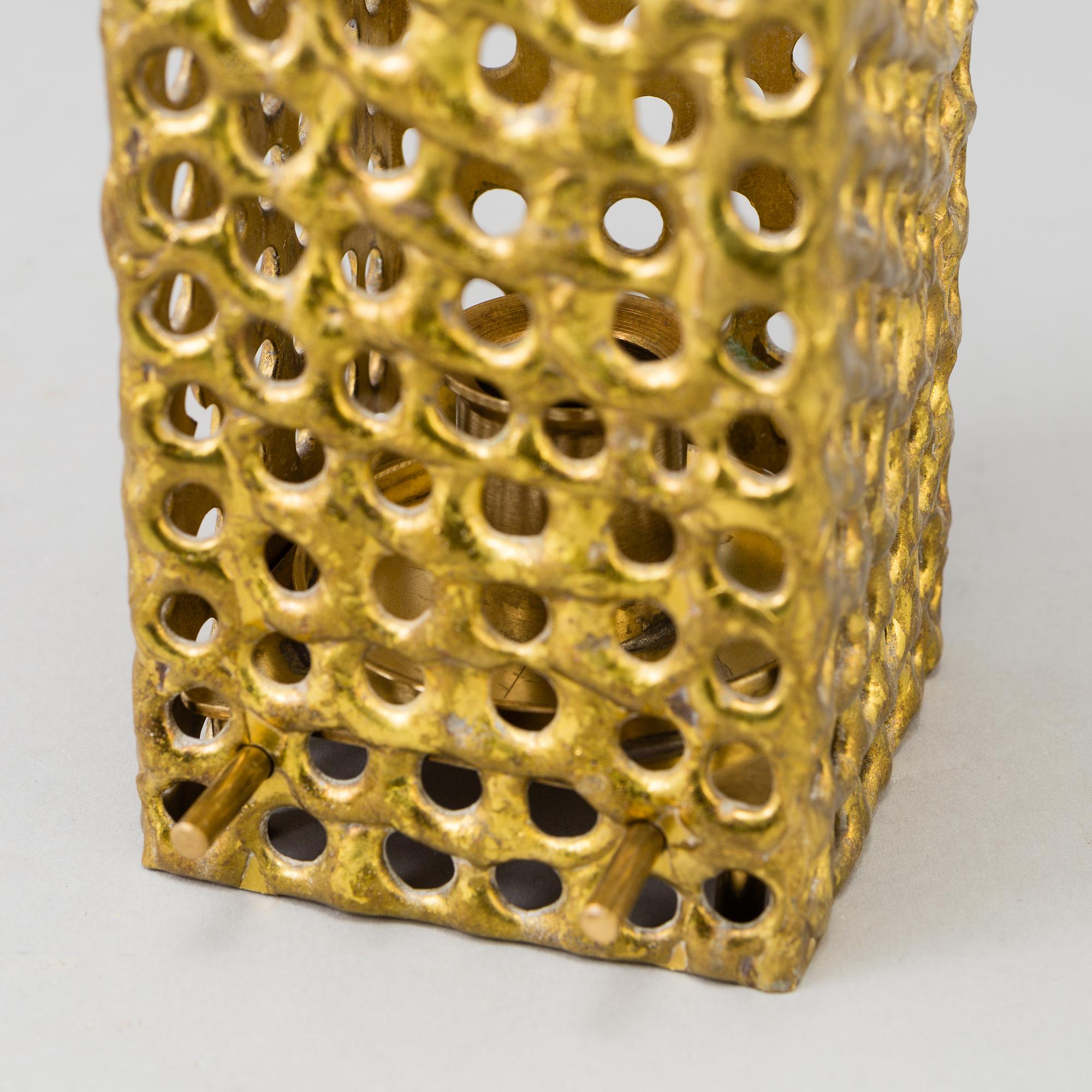 a brass ceiling light by Pierre Forsell for Skultuna.