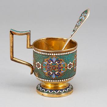 A Russian late 19th century silver-gilt and enameld tea-glass holder, unidentified makers mark, Moscow 1895.