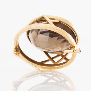 Brosch 18K guld med en fasettslipad rökkvarts.