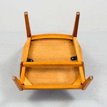 A "Vapensmeden" pine armchair by Carl Malmsten.