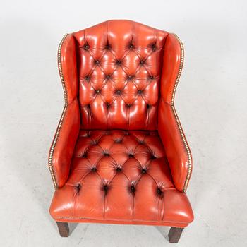 A late 20th century wingback leather chair.