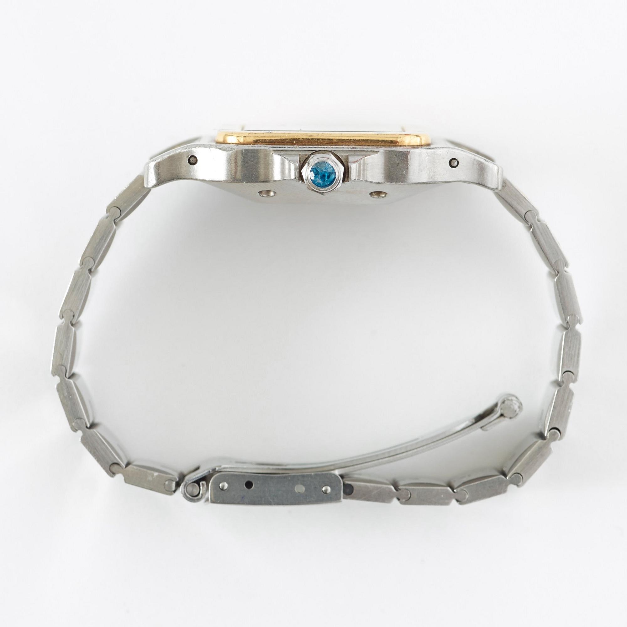 Cartier - Santos. Steel / Gold. Automatic. 28 x 29 mm.
