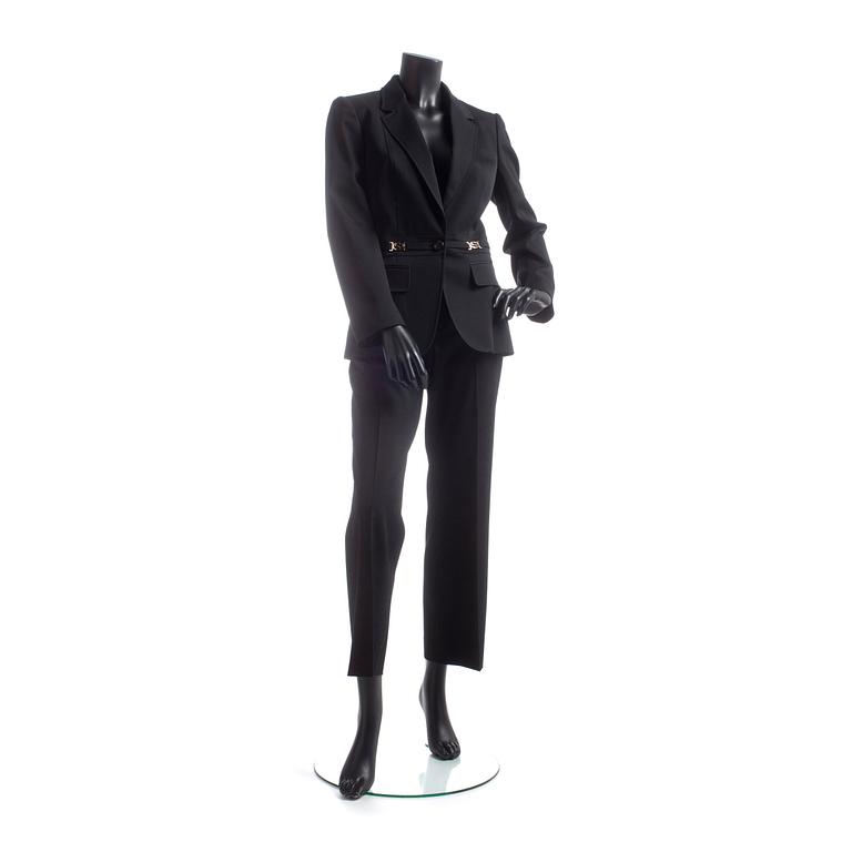 GUCCI, a two-piece suit consisting of jacket and pants.