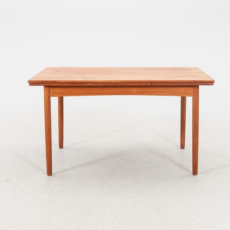 A 1960s teak dining table.
