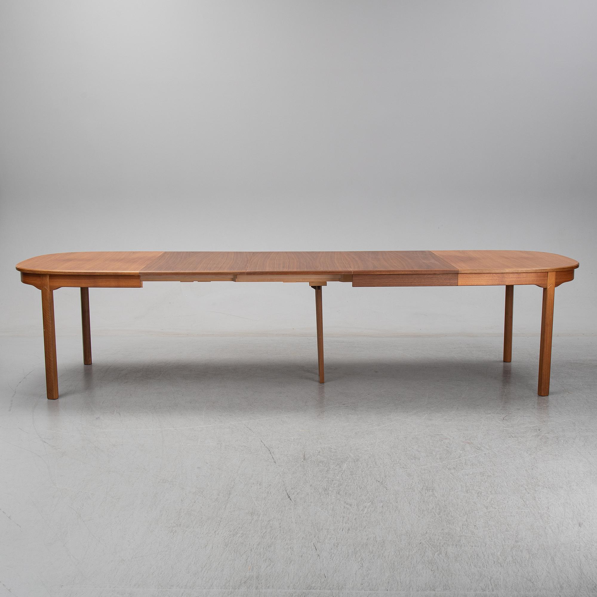 Carl Malmsten, A five-piece walnut 'Ambassadör' dining suite by Carl Malmsten.