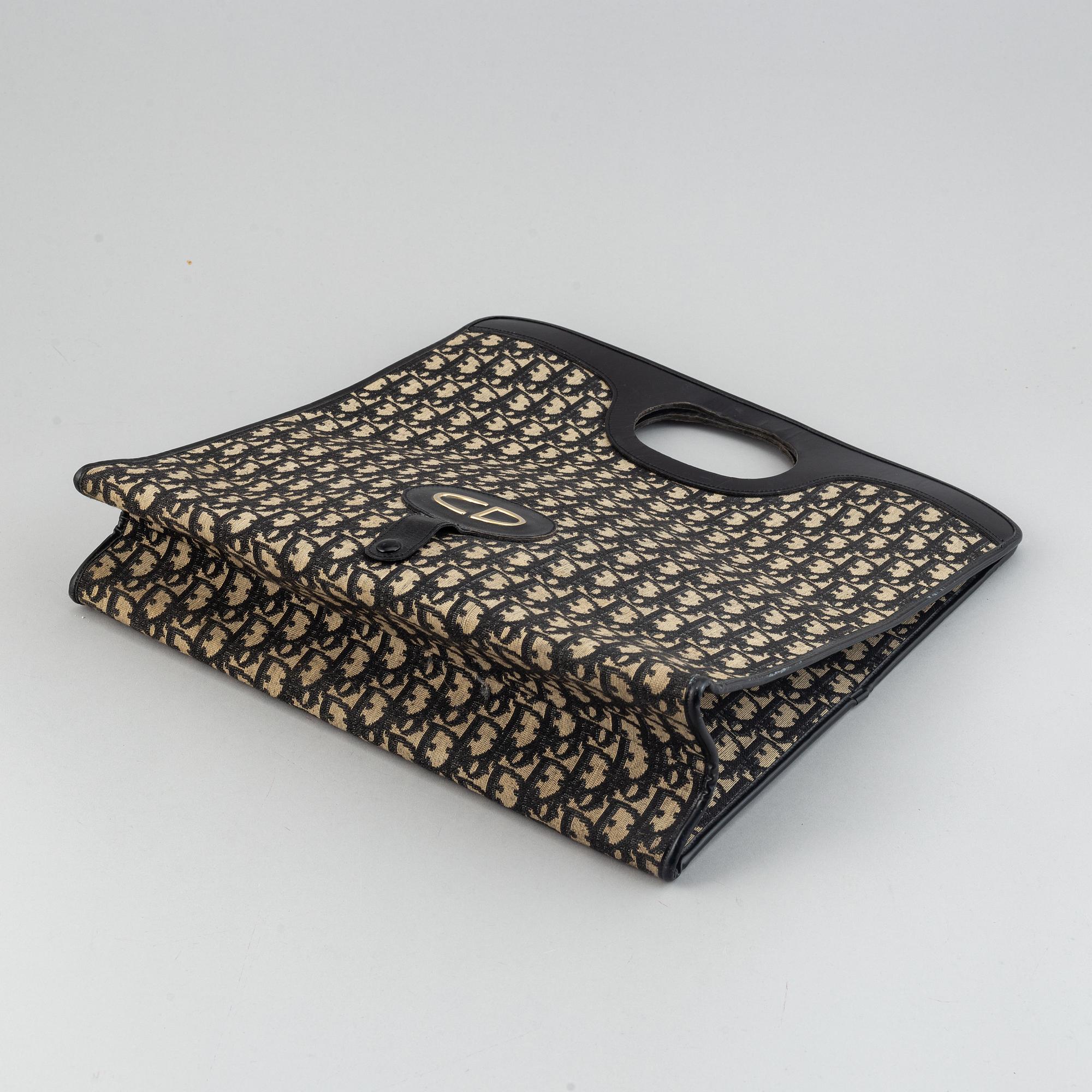 Christian Dior Oblique fold over convertible clutch. Bukowskis