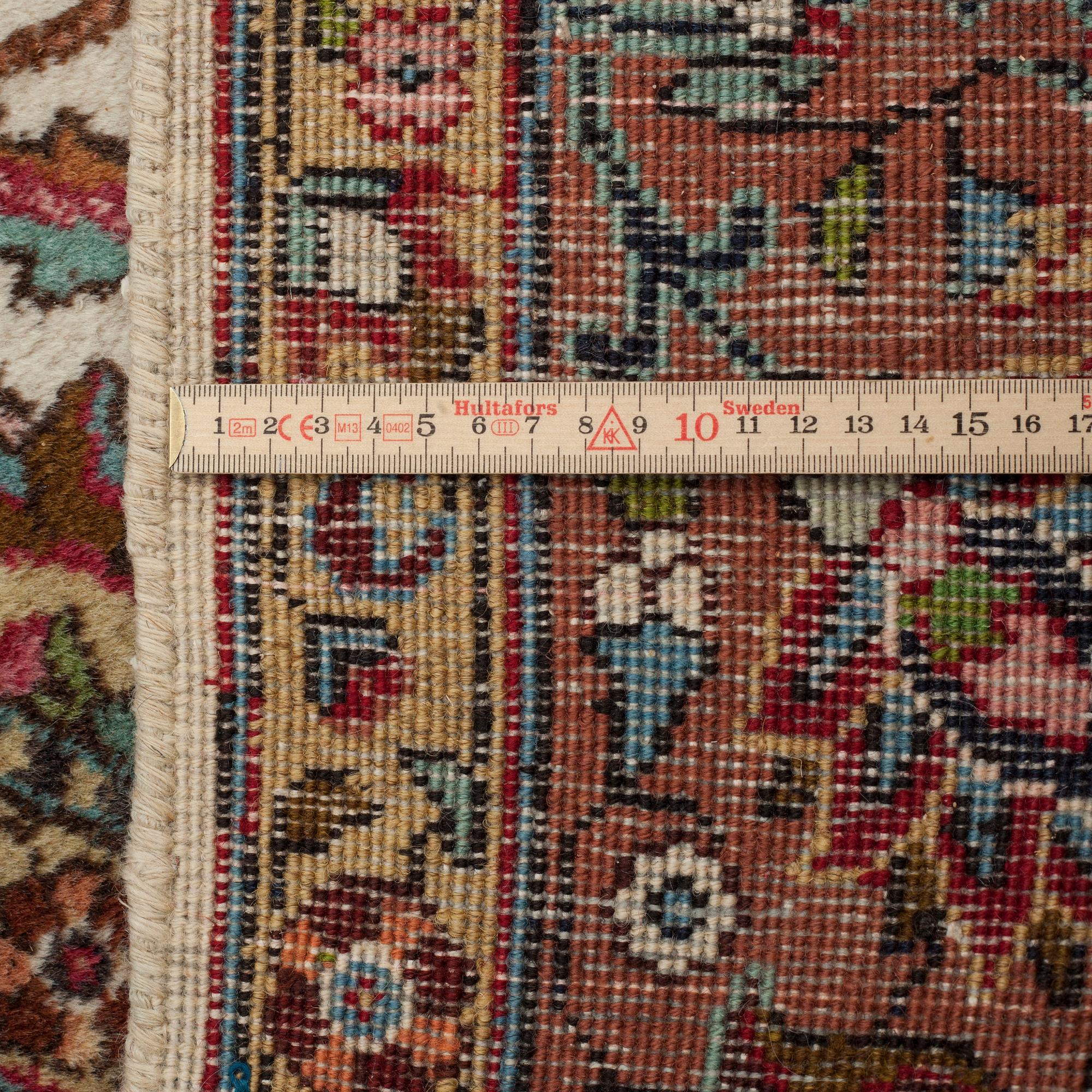 MATTO, a semi-antique Tabriz, ca 311 x 208 cm.