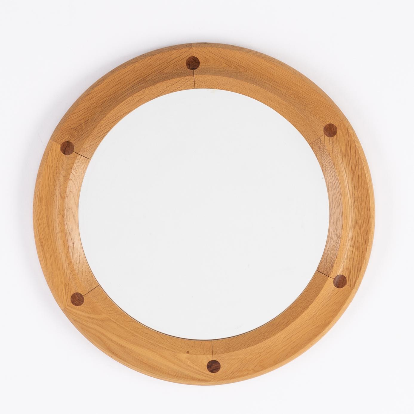 A round oak mirror by Åke Fribyter for Aktuell Form AB, second half of the 20th Century.