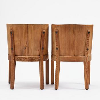 Axel Einar Hjorth, a pair of stained pine "Lovö" armchairs, Nordiska Kompaniet, Sweden, 1930s.