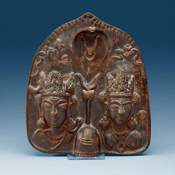 1857. A Indian bronze stele with Shiva and Parvati, presumably 17/18th Century.