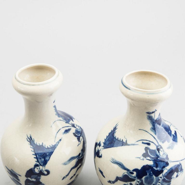 A set of two pairs of Kangxi and Kangxi style blue and white porcelain vases.