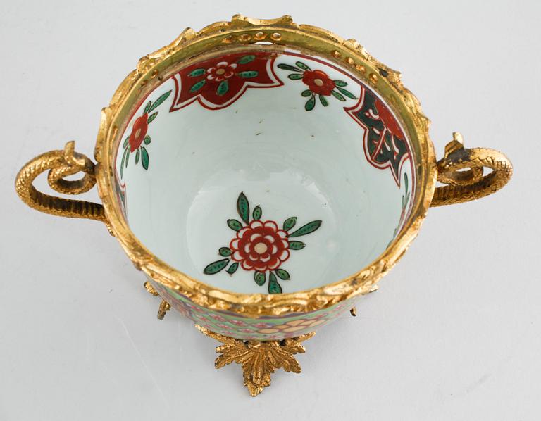 Three polychrome cups with barrels, three cups, one bowl with lid and one plate, Qing dynasty, 18/19th century.