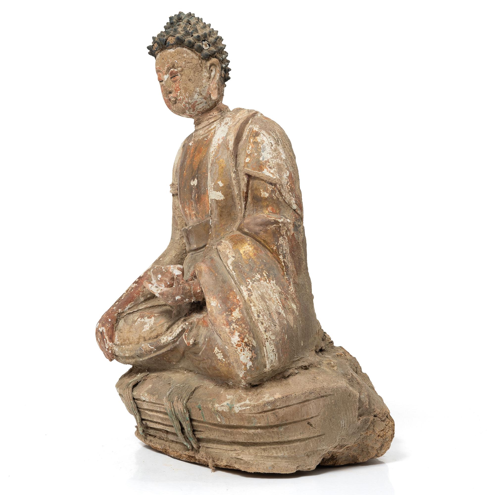 A Southeast Asian figure of a Buddha, 20th century.