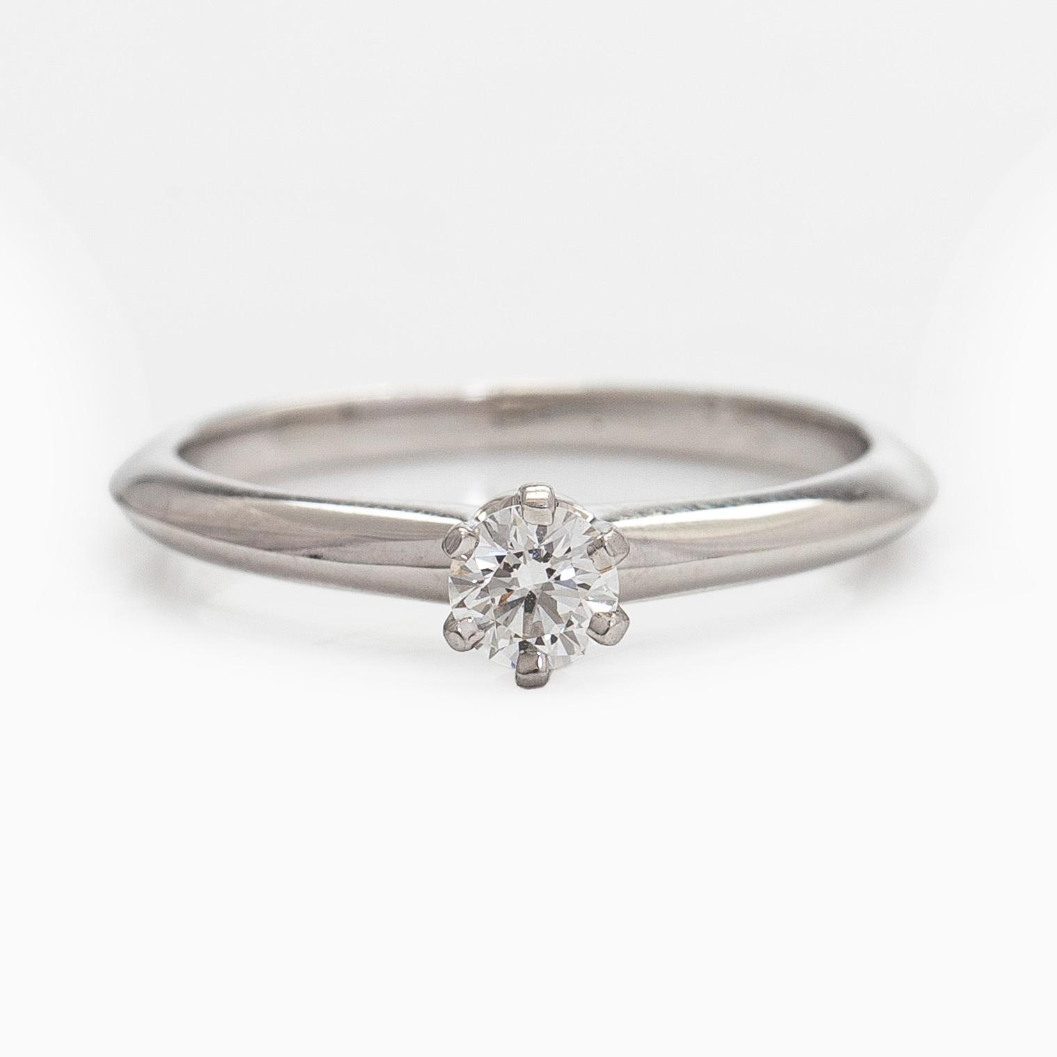 Tiffany & Co, a platinum solitaire ring with a brilliant-cut diamond.