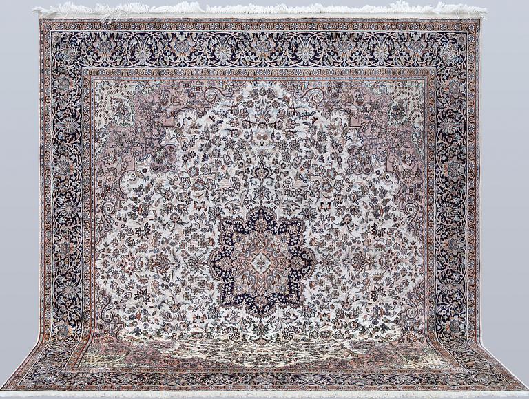 A Kashmir silk rug, approx. 215 x 212 cm.