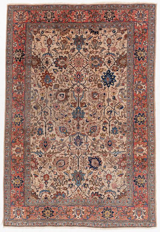 A semi antique Tabriz carpet, c. 290 x 195 cm.