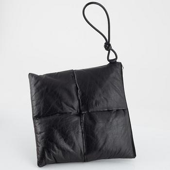 Bottega Veneta, a black leather handbag.