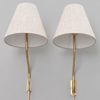 A pair of mid-20th century '3053' wall lights for Stockmann Orno, Finland.