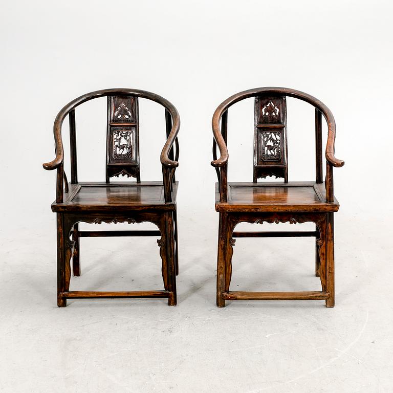 A pair of Chinese hardwood armchairs, circa 1900.